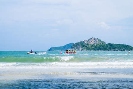 People enjoy playing in the seaのeditorial素材