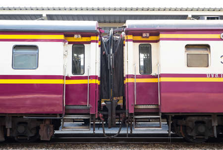 Crimson compartments of the old train on platform in Thailandの写真素材