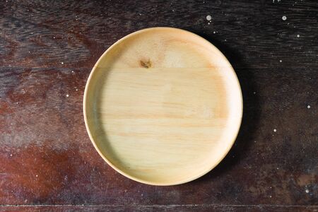 Wood dish on the wooden backgroundの写真素材
