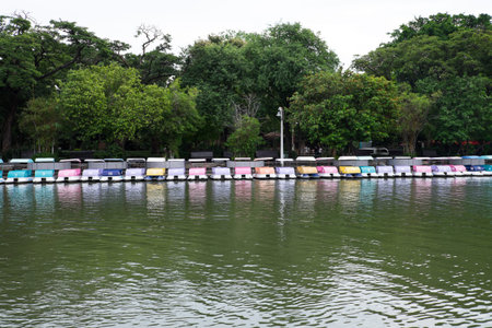 Colorful of pedal boats on the lake in the park