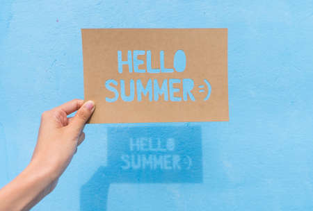 Shadow of text "Hello Summer" on blue background, summer timeの写真素材