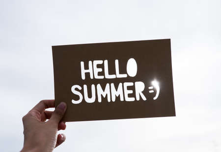 Text "Hello Summer" with sky background, sunshineの写真素材