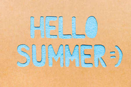 Text Hello Summer on paper with blue background, summer timeの写真素材