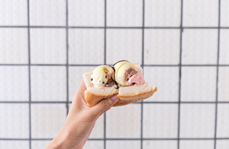Bread ice cream on hand with grid white background
