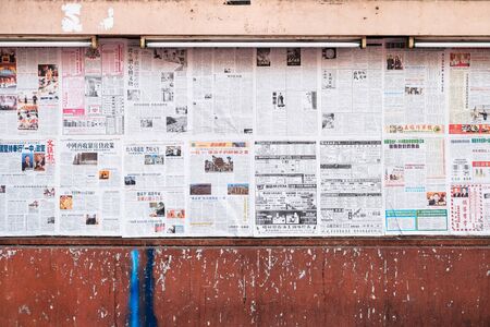 Bangkok, Thailand - 11 Feb 2017 : Chinese newspapers on the wall for free to readのeditorial素材