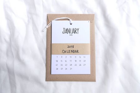 Vintage calendar 2018 handmade on white background with envelopeの写真素材