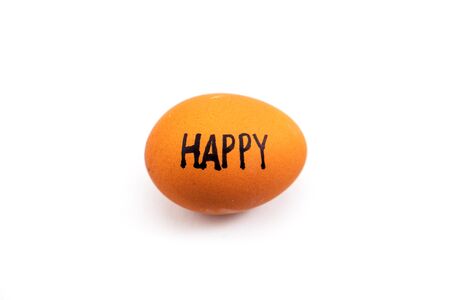 'HAPPY' text on egg isolated on white backgroundの写真素材