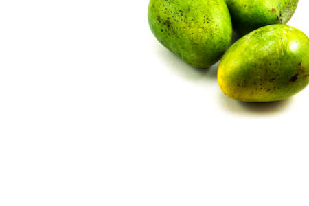 Fresh green mango fruit on white backgroundの写真素材
