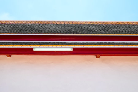 A beautiful roof with a fluorescent light tube and blue sky