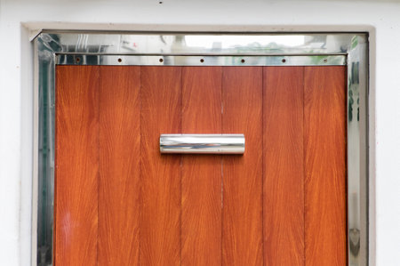 Half of wooden door entrance with stainless modern frame