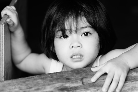 Closeup adorable face little asian girl have beautiful eyes after cry.の写真素材