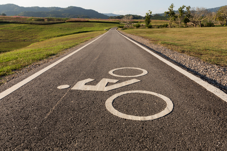Road sign for bikes and cyclists outdoors. Bicycle way symbol on park backgroundの写真素材