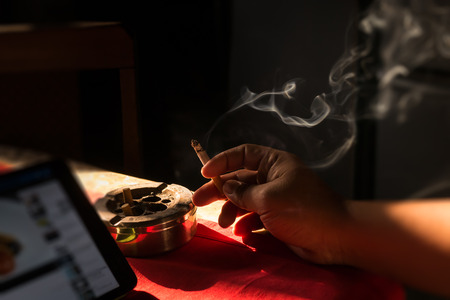 Cigarette on stainless ashtray. on moring light.の写真素材