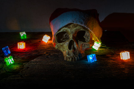 Still life skull wear santa claus hat with gift blinker light.の写真素材