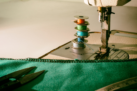 Four small roll thread and sewing machine.の写真素材