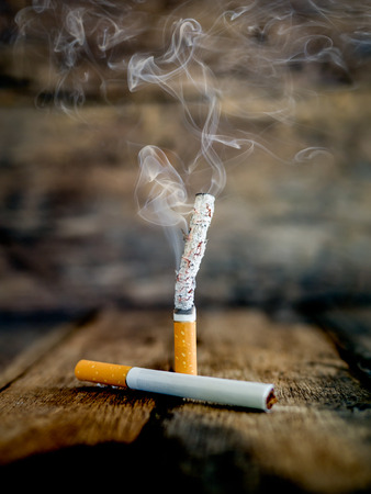 Still life cigarette people smoke cigarette and get toxin body look like way to die. In the day " World No Tobacco Day" please quit or stop smoke for good health.の写真素材