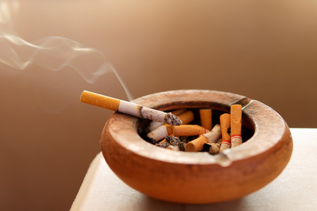 The more cigarette on ash and smoke.の写真素材