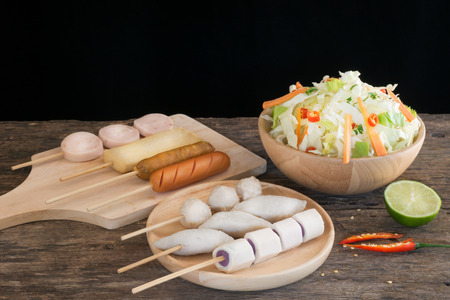 Meat, fish and sausage ball with mixed Vegetable. ready to make  mix dressed the taste sour and Spicy.の写真素材
