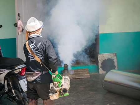 CHIANG RAI, THAILAND - MAY 21, 2016 : Men are working fogging to eliminate mosquito.のeditorial素材