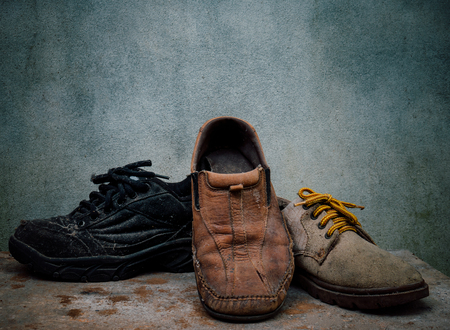 Still life old Leather shoes and belt. It more of dirty and  shabby skin. Time to change new shoes or repair.の写真素材