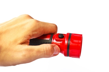 A red flashlight on a hand is a tool from Japan for our houseの写真素材