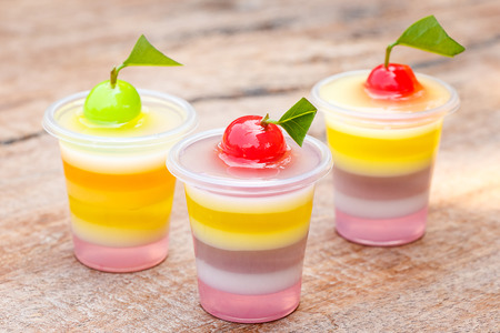 Colorful jellys with fruits in plastic cups, Shallow depth of field.の写真素材