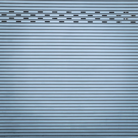 Blue color corrugated metal sheet as backgroundの写真素材