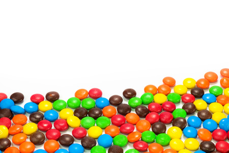 A pile of colorful chocolate coated candyの写真素材