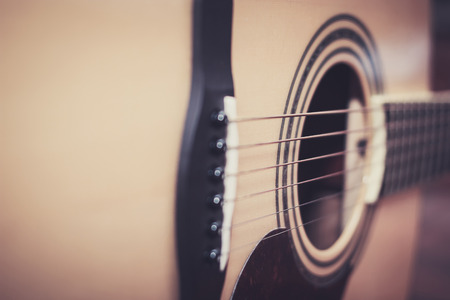 Close up of acoustic guitar, select focus with shallow depth of field.の写真素材