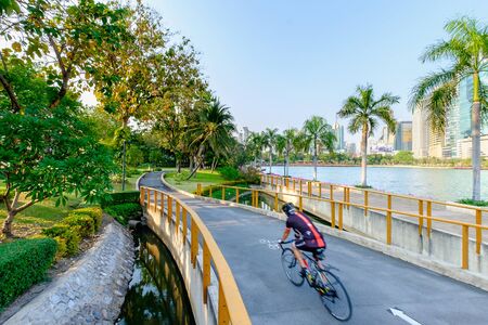 Bangkok, Thailand - March 5, 2016: People ride bicycle in the Benchakitti Park in Bangkok. Benjakiti Park is a park in honor of Her Majesty Queen Sirikit, is located in the factory area.のeditorial素材