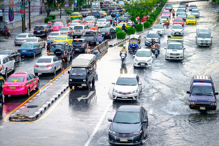Bangkok, Thailand - May 27, 2017: Thai flood hits Central of Thailand, higher water levels expected, cars navigating through the floodのeditorial素材