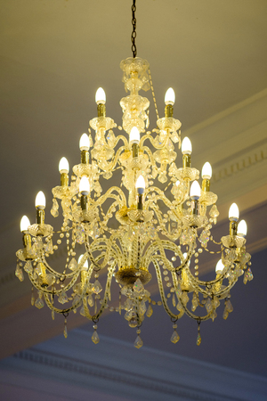 Beautiful crystal chandelier in a roomの写真素材