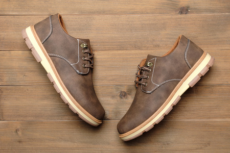 Man shoes on wood tableの写真素材