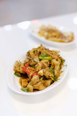 Stir-fried chicken or ginger and mixed vegetables on white table.の写真素材