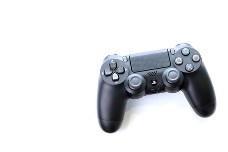 Bangkok, Thailand - January 12, 2021: The new Sony Dualshock 4 with PlayStation 4. Sony PlayStation...