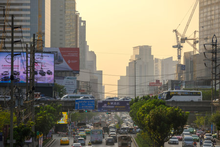 Bangkok, Thailand - Mar. 16, 2023: Traffic jam and pollution issues. The urban background is filled...