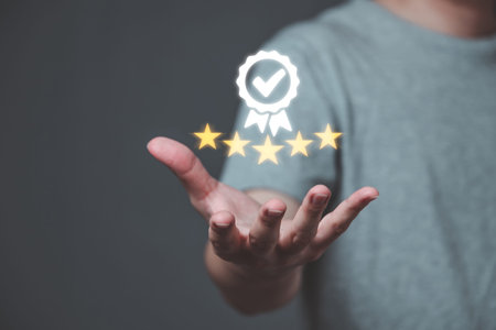 Hand of a business man Showing the symbol of leading service, the 5 star symbol and the guarantee...