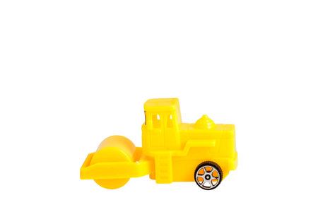 Yellow steamroller toy isolated on white background