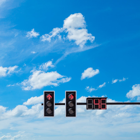 traffic light with red light on blue sky backgroundの写真素材