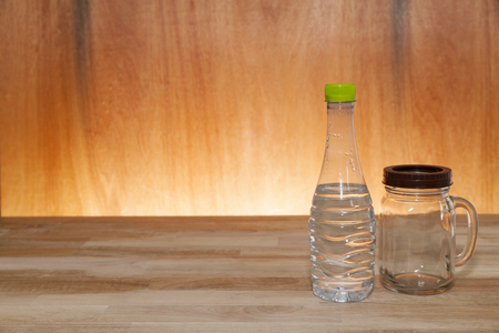 bottled water on wood terrace and light wooden interiorの写真素材