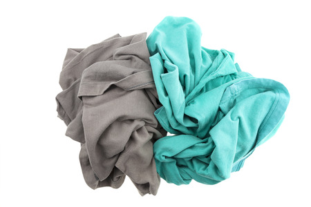 pile dirty clothes isolated on white backgroundの写真素材