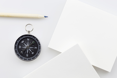 compass with blank white business paper,pencil on white background,Business direction conceptの写真素材