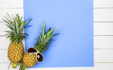 pineapple fruits on white wooden background,concept summer backgroundの写真素材