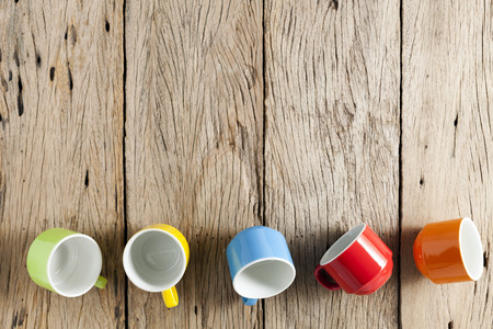 colorful coffee cup on old wooden backgroundの写真素材