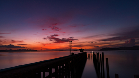 scenery view of old jetty to the sea beautiful sunrise or sunset in phuket thailandの写真素材