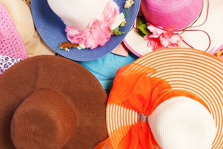 Beautiful set of summer hats on wooden background,flat lay styleの写真素材