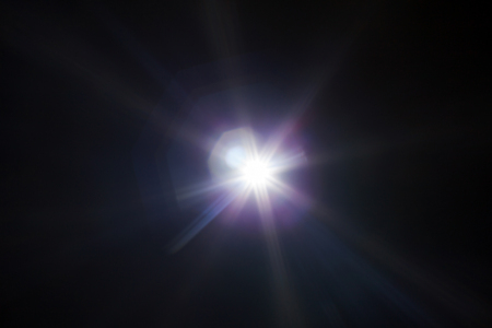 White light flare special effect in dark blackの写真素材