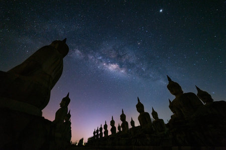 Big Buddha statue with milky way galaxy in Nakhon si thammarat Province, Thailand.