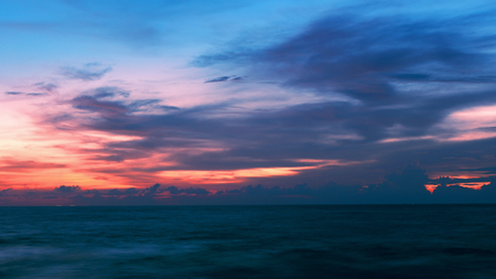 dramatic sky over sea in sunset evening timeの写真素材