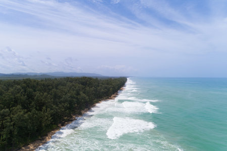 Tropical sea with wave crashing on beach aerial view drone shot